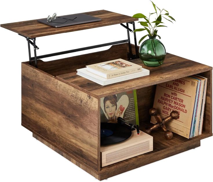 a wooden table with books and a plant on top