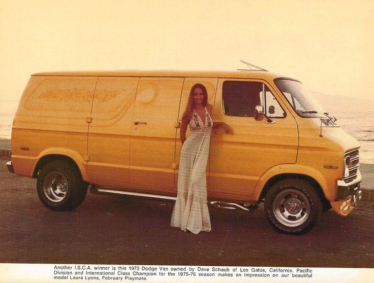 a woman standing next to a yellow van