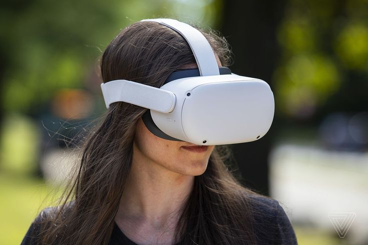 a woman wearing a white virtual reality headset