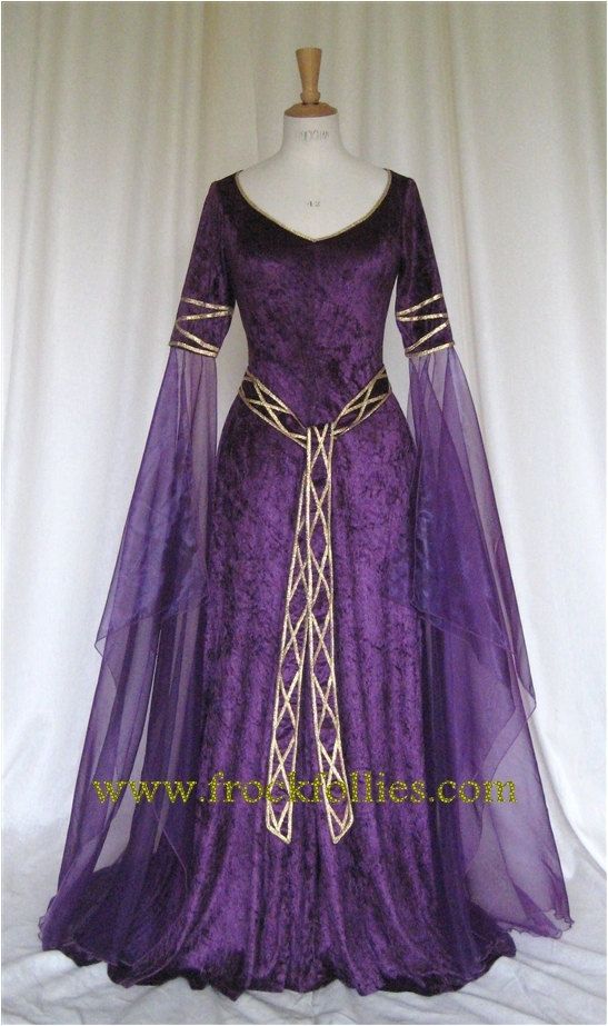 EVE, CELTIC IN INSPIRATION, ELEGANT AND FLOWING IN DEEP PURPLE CRUSHED VELVET WITH GOLD TRIM IS DESIGNED AND CUSTOM MADE BY frockfollies. PERFECT Elven Style Wedding Dress With Historical Design, Elven Wedding Dress With Historical Design, Fantasy Style Fitted Wedding Gown, Fantasy Wedding Gown With Fitted Bodice, Fitted Fantasy Wedding Gown, Fantasy Style Floor-length Wedding Dress, Fantasy Floor-length Wedding Dress, Medieval Floor-length Wedding Dress, Medieval Style Floor-length Wedding Dress