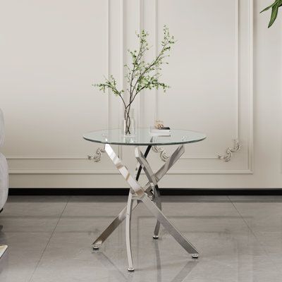 The 23.6" glass round end table is easy to clean and waterproof. This round end table, with a diameter of 23.6", features tempered glass and chrome legs that provide corrosion resistance. The shiny finish makes this table an attractive addition to your room. Mercer41 Table Base Color: Silver | Mercer41 Authur End Table 21.9 H x 23.6 W in grayStainless Steel in Silver | 21.9" H X 23.6" W | Wayfair Round End Table, Table Base, End Table, Base Colour, X 23, End Tables, Tempered Glass, Living Room Furniture, Side Table