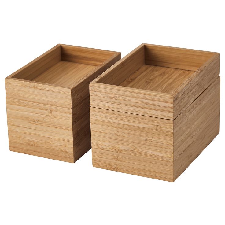 two wooden boxes sitting next to each other