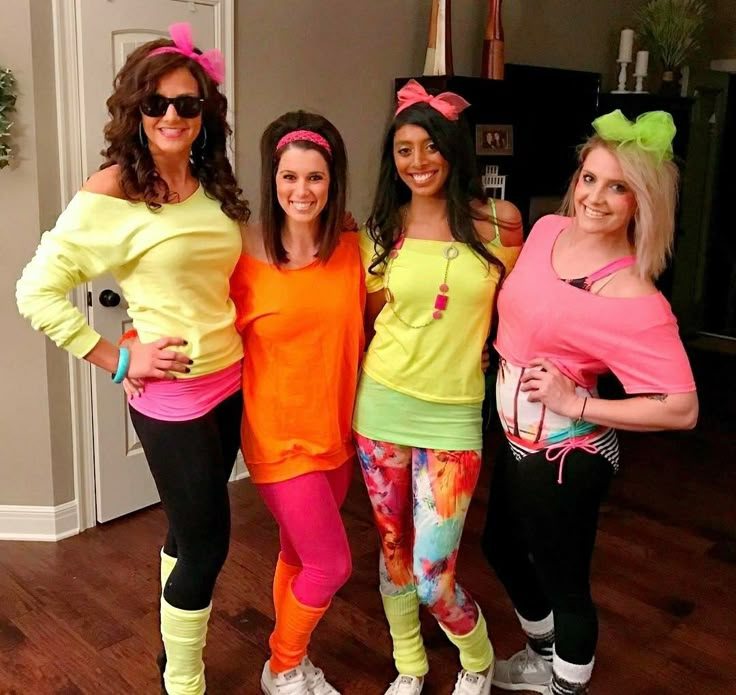 three women in costumes posing for the camera