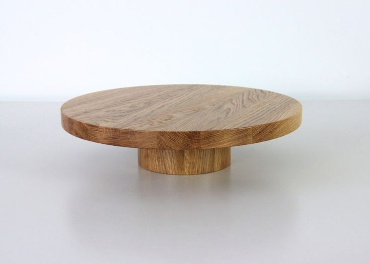 a round wooden object sitting on top of a white table