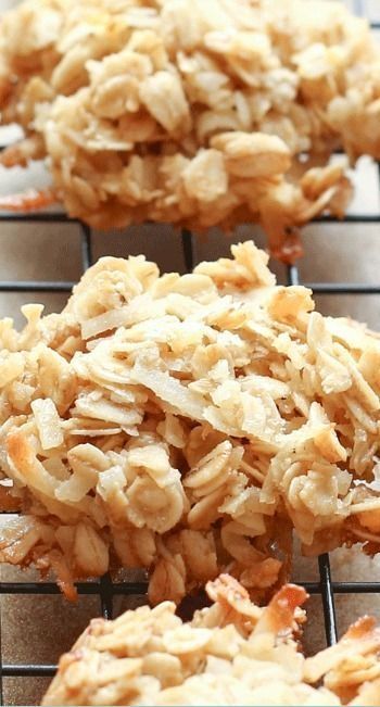 several cookies cooling on a wire rack with oatmeal toppings in the middle