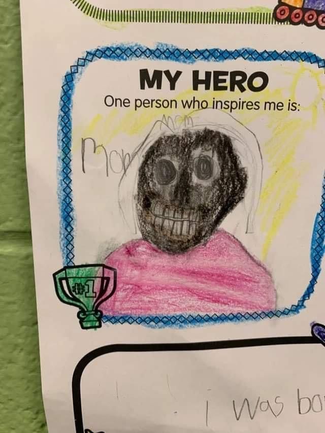 a paper sign with a drawing of a person's face and name on it that says, my hero one person who inspires me is