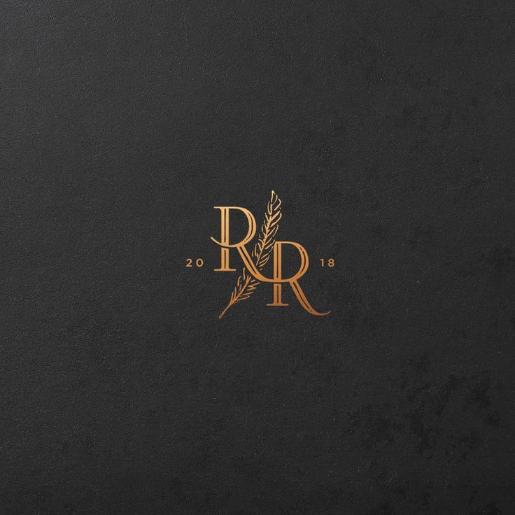 a black book with gold lettering and a monogrammed r on the front cover