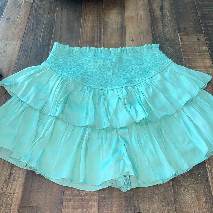 Perfect Condition Skirt Never Worn Adorable Solid Color Tiered Skort With Lined Skirt, Solid Color Tiered Lined Skort, Lined Tiered Skort, Tiered Lined Skort, Short Length Ruffled Relaxed Skirt, Spring Short Ruffled Skirt, Solid Short Flowy Skirt, Spring Ruffled Short Skirt, Short Relaxed Lined Skirt