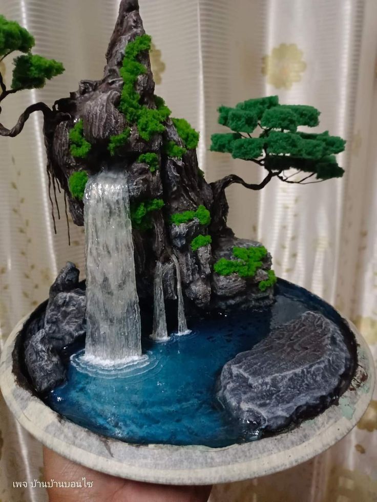 a miniature waterfall in the middle of a table