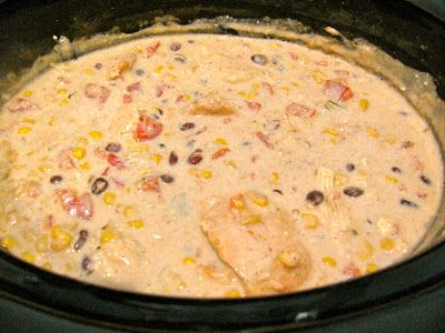 a crock pot filled with corn and black beans