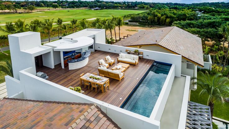 an aerial view of a house with a swimming pool