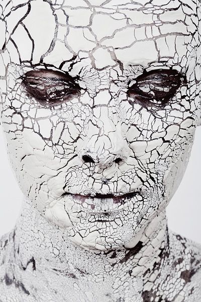 an image of a woman with cracked skin on her face