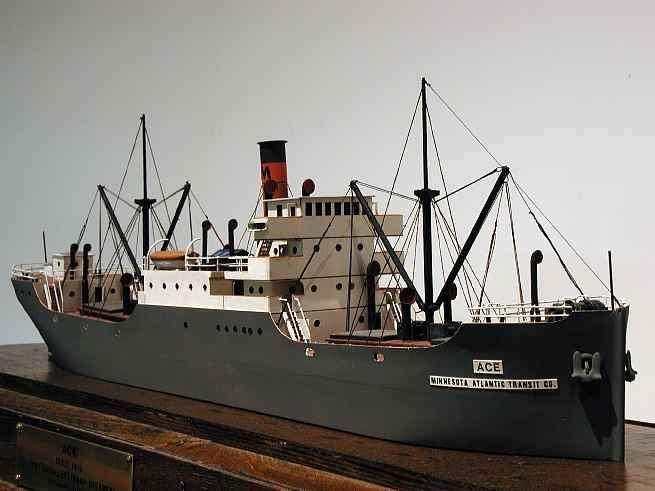 a model ship sitting on top of a wooden table