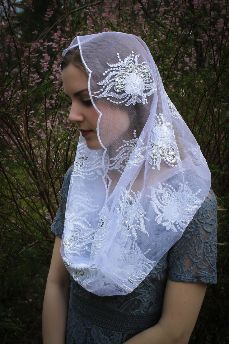 READY TO SHIP! PLEASE NOTE! Ships in 1-2 days. ONLY veils that state READY TO SHIP will ship in 1-2 days. Please order our custom veils on a separate order, or the entire order will ship within 2-3 weeks. A unique, handmade veil in an elegant, couture quality embroidered champagne mesh lace, with soft metallic gold accents/tiny sequins. Or white with silver accents. Please choose color at checkout. Includes a sewn-in clip. Measures about 46 X 21 inches. Evintage veils are handmade in limited pro Traditional White Veil, Lace Headwrap, Elegant Couture, Veil Mantilla, Elegant Veils, Latin Mass, Beautiful Veil, Chapel Veil, Silk Tulle