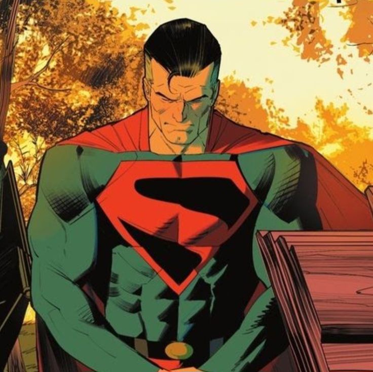 a man in a superman costume standing next to a tree and bench with his hands on his hips