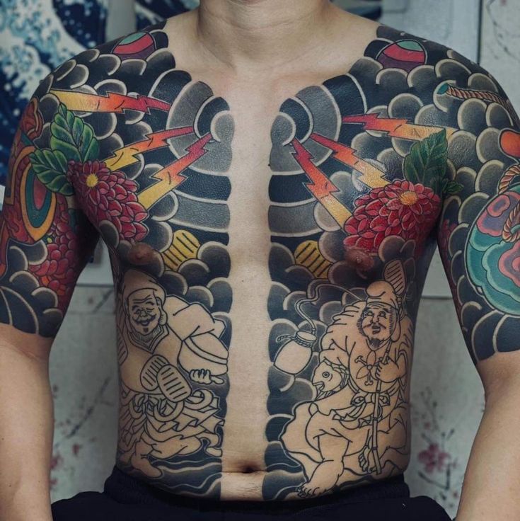 a man with lots of tattoos on his chest