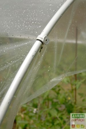 the inside of an umbrella with water droplets on it