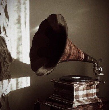 an old fashioned record player on top of a table