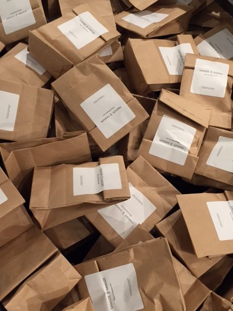 a pile of brown paper bags filled with papers