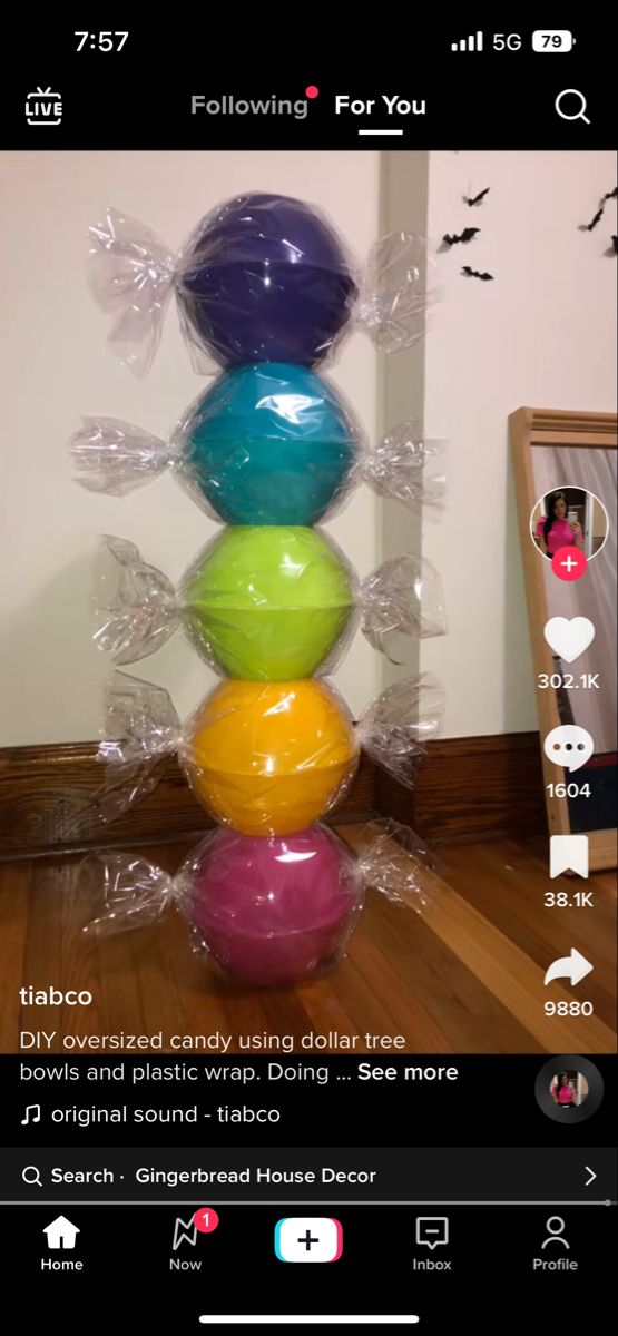 a stack of balloons sitting on top of a wooden floor