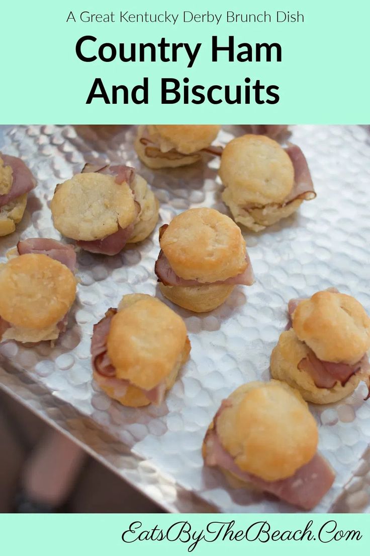 some ham and biscuits are sitting on a tray with the words country ham and biscuits