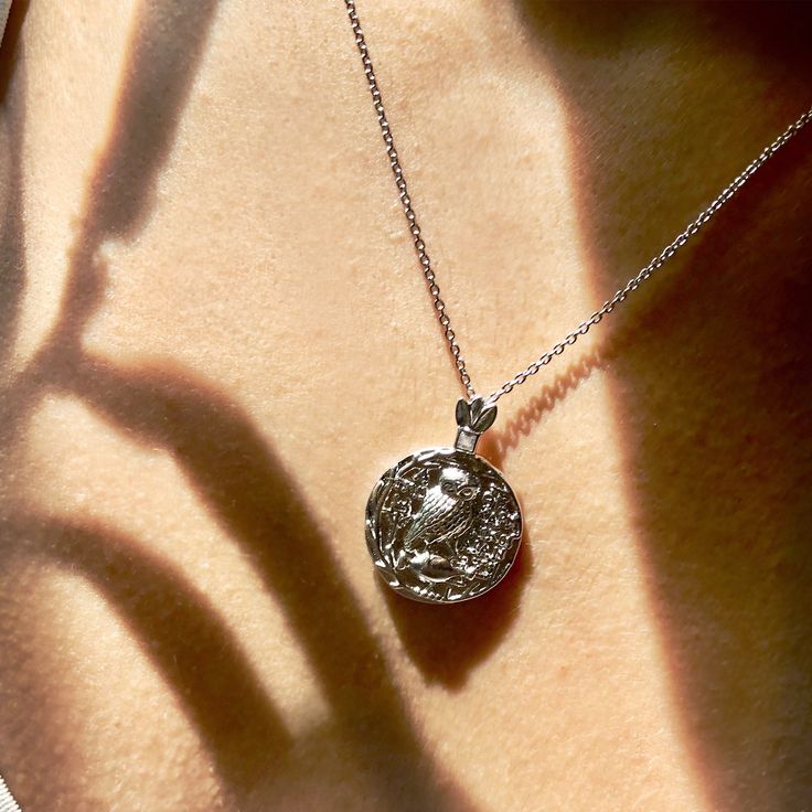 For this necklace we referenced an ancient Roman coin that depicted an owl, the symbol of wisdom and a symbol of Athena, the patron Goddess of Athens. In art, she is generally depicted wearing a helmet and holding a spear and is associated with wisdom, handicraft, weaving and warfare. In Greek mythology, Athena was believed to have been born from the forehead of her father Zeus. In the founding myth of Athens, Athena bested Poseidon in a competition over patronage of the city by creating the fir Athena Vibes, Athena Jewelry, Greek Mythology Athena, Athena Owl, Greek Mythology Jewelry, Mark Of Athena, Ancient Greek Jewelry, Boys Necklace, Symbol Of Wisdom