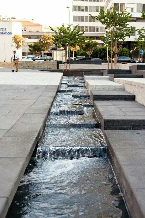 the water is running down the steps in the city