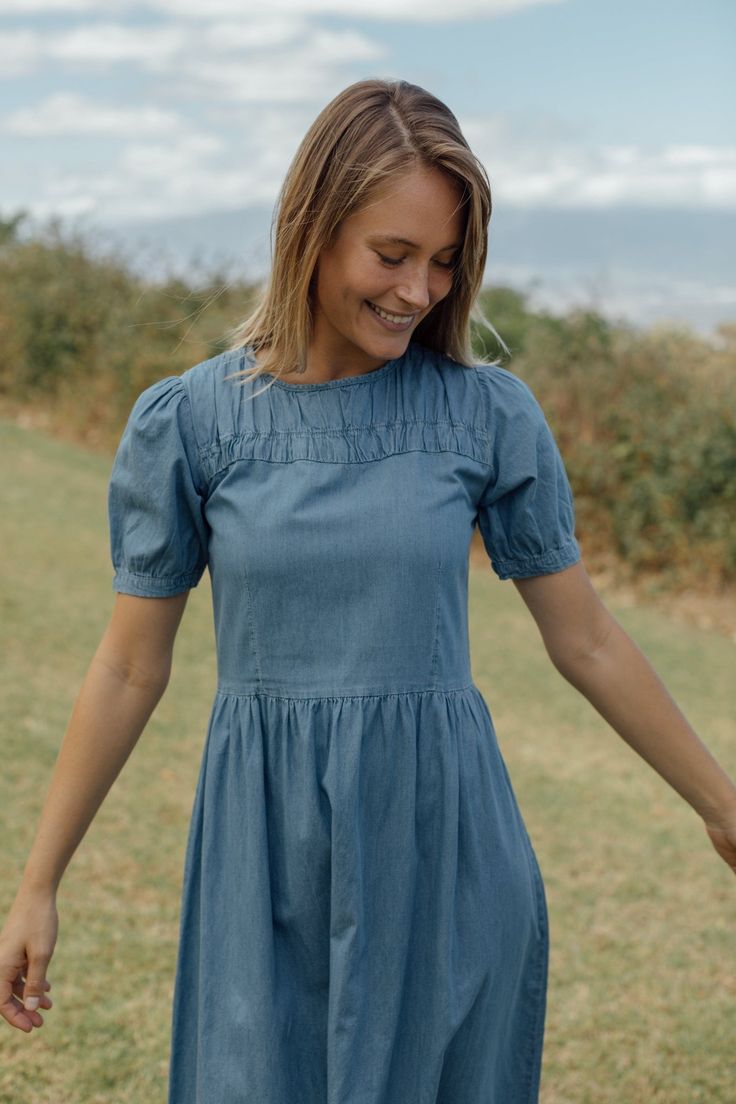 A beautiful soft denim dress with a smocked collar featureLENGTH: 46" Made In China Farmhouse Wardrobe, Dresses Feminine, Build Your Wardrobe, Neutral Capsule Wardrobe, Fashion Romantic, Maternity Wardrobe, Fall Sale, Pregnancy Wardrobe, French Country Farmhouse