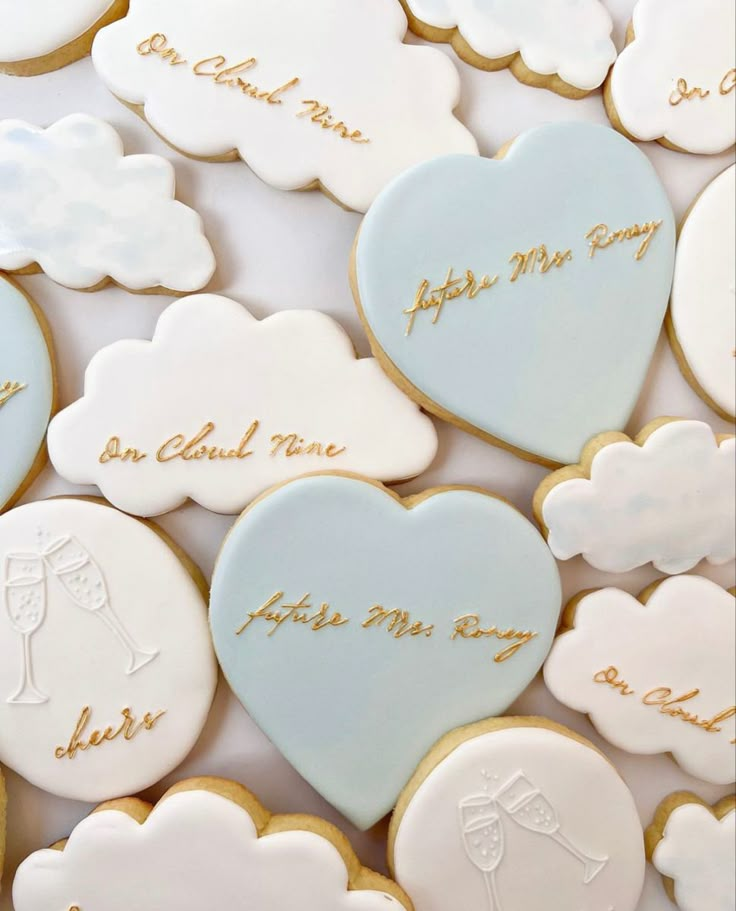 some cookies that have been decorated with words and pictures on them in the shape of hearts