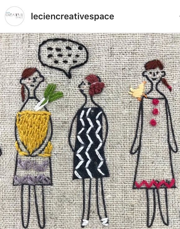 three people with flowers in their hands on a piece of fabric that has been embroidered onto it