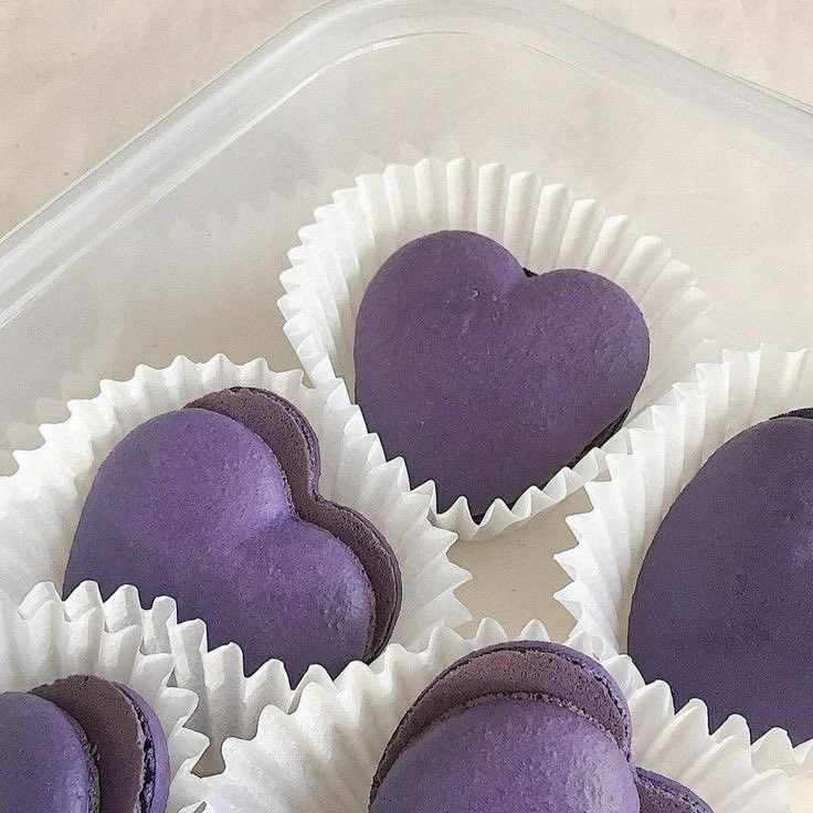 purple heart shaped chocolates in white paper cups