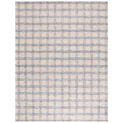 a white and blue plaid rug on a white background