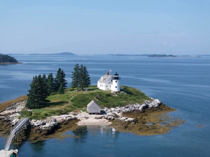 an island with a lighthouse in the middle of it