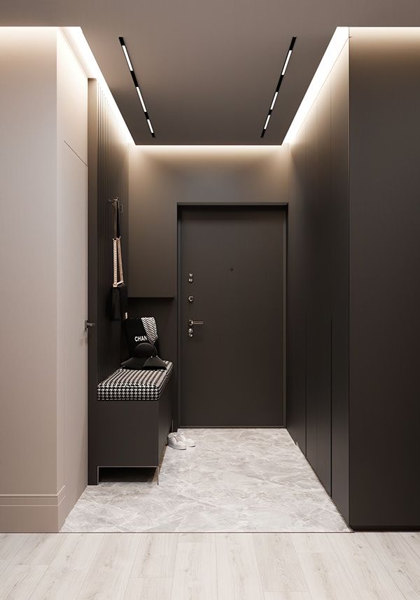 an empty hallway with black and white decor