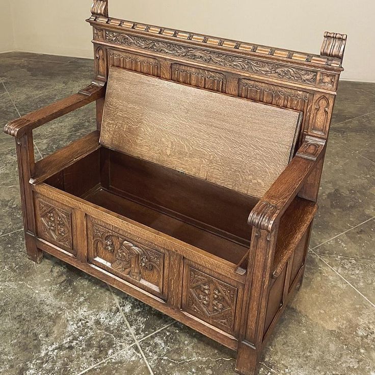 an old wooden bench sitting on top of a tiled floor