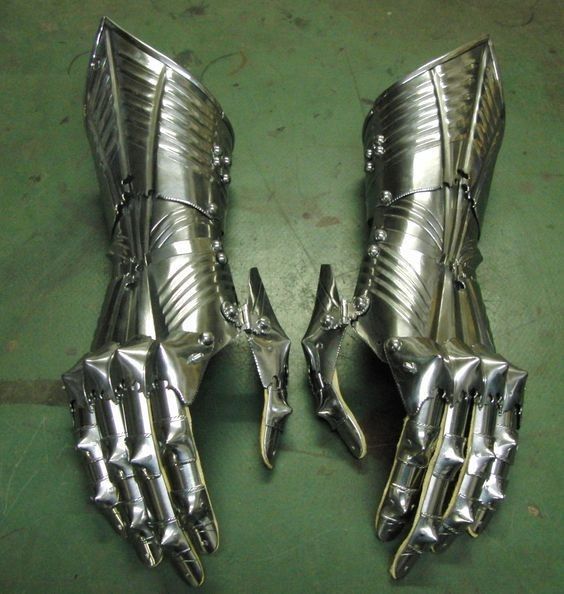 two metal hands that are on the ground