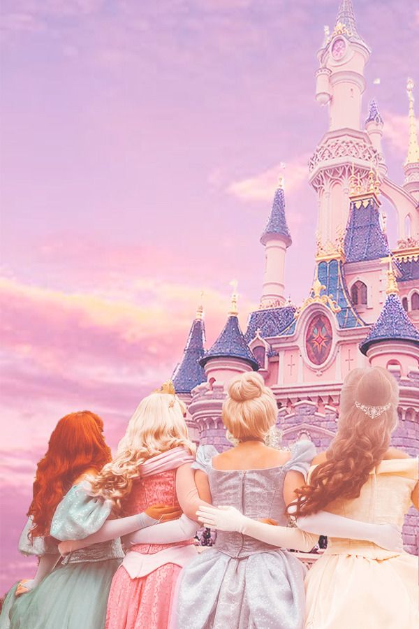 there are four girls standing in front of a castle with their arms around each other