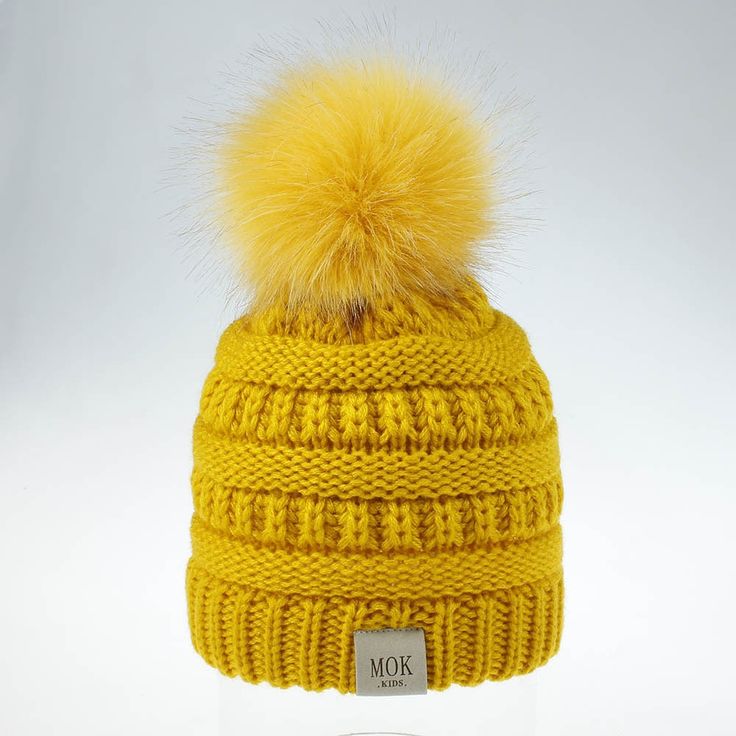 Keep your kid warm with this yellow beanie hat. Great for children age 1 to 7 years. This knitted cotton hat comes in red Cute Yellow Winter Hat, Hand Knitted Mini Beanie Hats For Winter, Winter Playful Soft Knit Bonnet, Playful Crochet Cap For Winter, Playful Crochet Winter Cap, Playful Winter Crochet Cap, Warm Snug Cozy Hats, Warm Cozy Snug Hats, Cozy Warm Snug Hats