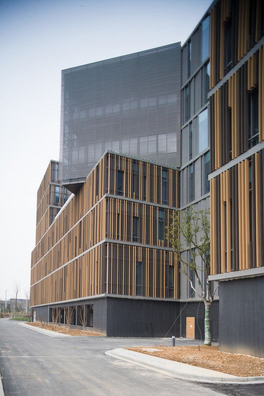 two buildings with wooden slats on the sides