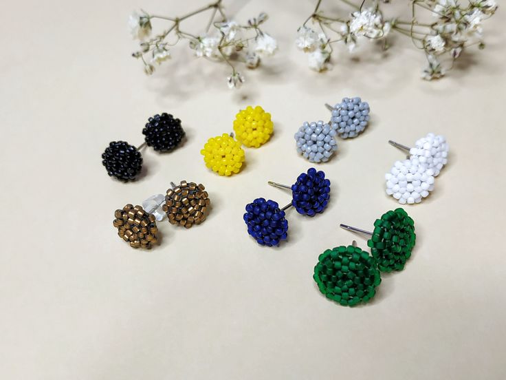 "For girls who appreciate minimalism, these little stud earrings are geometric in shape for every day. Universal jewelery. These earrings made by me from the highest quality materials: Toho Japanese seed beads and stainless steel furniture. ✦ round diameter - 0.3\" (8 mm) ✦ round diameter green earrings - 0.4\" (10 mm) ✦ light weight ✦ silicon push back ✦ on the reverse side, the earrings look the same. The price is for 1 pair of earrings A sturdy coating of Toho beads will serve for a long time Trendy Earrings With Tiny Beads As Gift, Trendy Earrings With Tiny Beads For Gifts, Minimalist Handmade Beaded Earrings For Everyday, Geometric Outfit, Stainless Steel Furniture, Bronze Green, Toho Beads, Cardboard Gift Boxes, Seed Bead Patterns