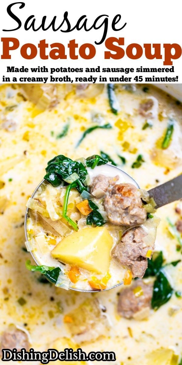 sausage potato soup in a bowl with a ladle full of cheese and spinach