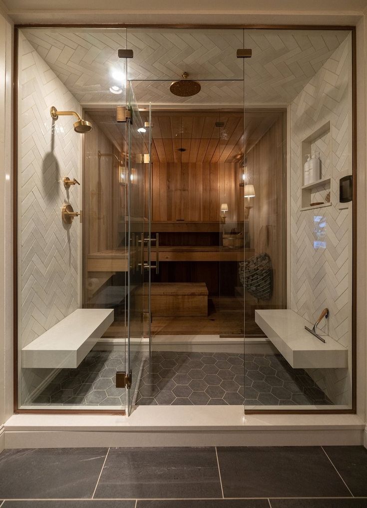 a bathroom with a walk in shower next to a bath tub