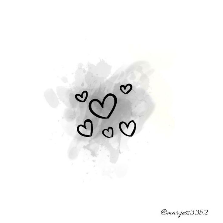 some black and white hearts are on a white background with paint splattered around it