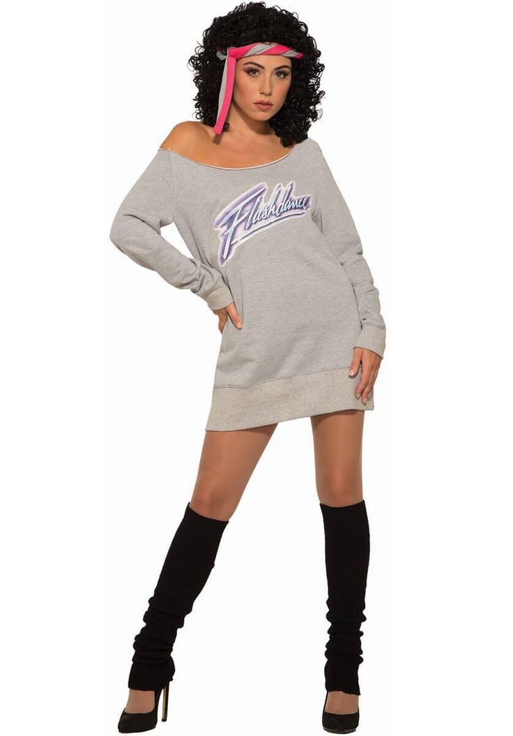 a woman in a grey sweatshirt dress and black thigh high boots posing for the camera