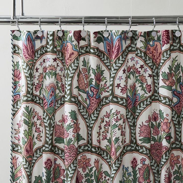 a shower curtain with floral designs on it