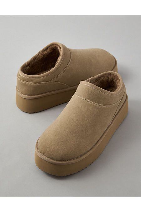 Slip-on silhouette/Round toe/Lined with faux shearling/Elevated platform sole Winter Slip On Shoes For Women, Trending Slippers, Platform Slippers Outfit, Women’s Slippers, Casual Platform Slip-on Slippers With Textured Sole, Trendy Textured Slip-on Platform Slippers, Spring Brown Slip-on Platform Slippers, Comfortable Brown Slip-on Platform Slippers, Fall Slippers