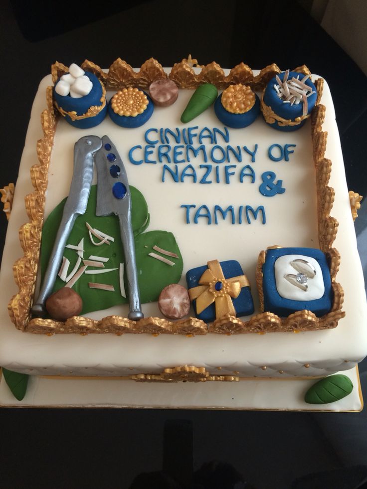 a birthday cake with the name and symbols on it