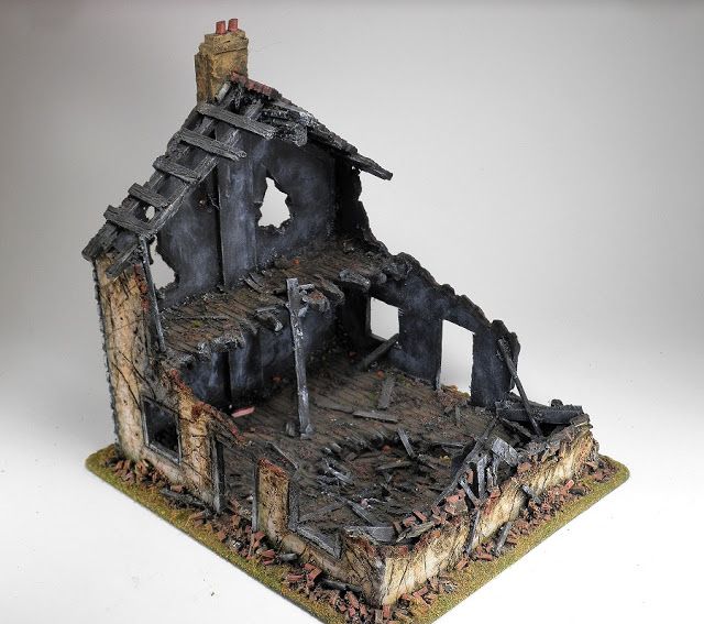 a small model of a house that has been destroyed