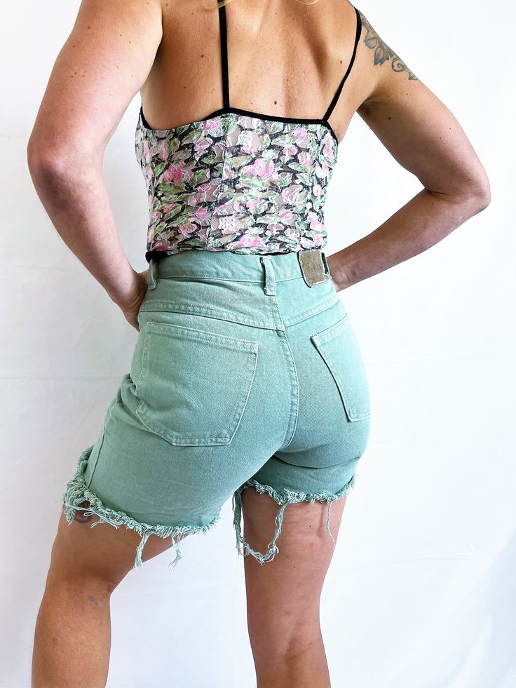 "Fun shorts. Size 6 100% cotton Cut off Zips in the front Lying flat.. 14\" top to bottom Across waist: ~13 1/2\" Across hips: ~18 1/2\"" Retro Cotton Bottoms With Built-in Shorts, Spring High Waist Tops With Frayed Hem, Retro Cotton Cutoff Shorts, Green High-waisted Cotton Jean Shorts, Fitted Tops With Frayed Hem In Short Length, Green Cotton Jean Shorts For Spring, Green Cotton Jean Shorts, Retro Cutoff Shorts For Spring, Cotton Cutoff Shorts For Spring