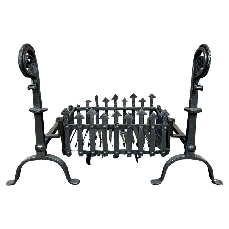 two metal racks with black wrought iron designs on each side and one holding several keys